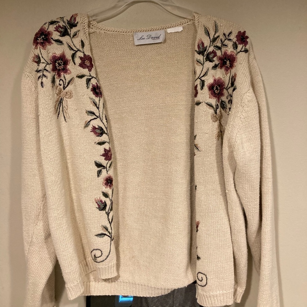 a tan cardigan with flowers